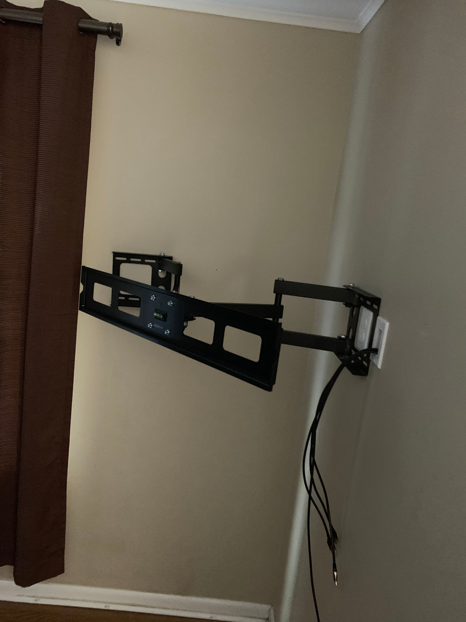 Television wall bracket and wall connections in a residential room